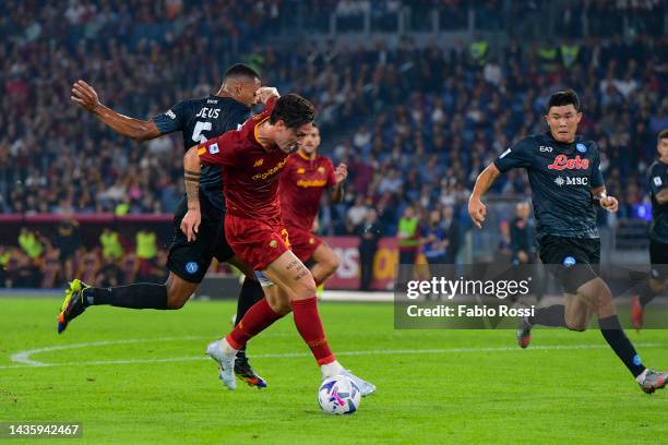 Nicolò Zaniolo of AS Roma is challenged by Juan Jesus of SSC Napoli during the Serie A match between AS Roma and SSC Napoli at Stadio Olimpico on...