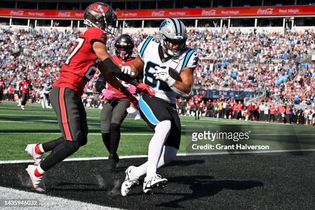 Tommy Tremble of the Carolina Panthers catches a touchdown in the fourth quarter against the Tampa Bay Buccaneers at Bank of America Stadium on...