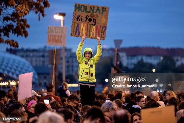 Protestor holds a banner that saying Who will teach tomorrow? during a sympathy march to show their support for teachers on October 23, 2022 in...