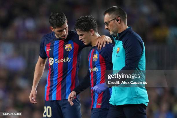 Gavi of FC Barcelona receives medical treatment and is substituted during the LaLiga Santander match between FC Barcelona and Athletic Club at...