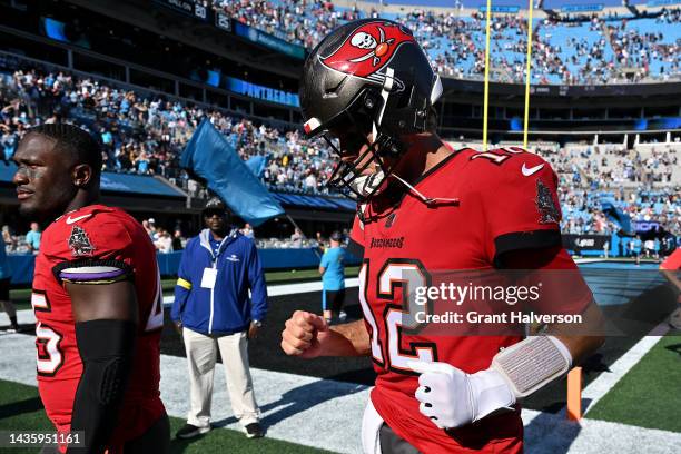 Tom Brady of the Tampa Bay Buccaneers leaves the field after a loss to the Carolina Panthers at Bank of America Stadium on October 23, 2022 in...