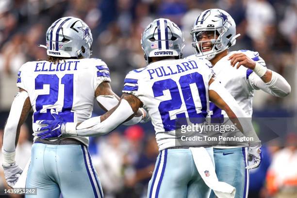 Dak Prescott of the Dallas Cowboys celebrates with Ezekiel Elliott and Tony Pollard after a touchdown against the Detroit Lions during the fourth...