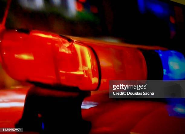 flashing lights on police car - crime concept - police lights stock-fotos und bilder