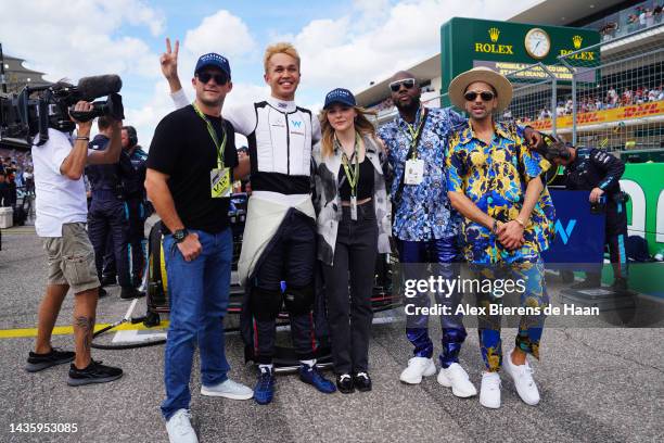 Scott Eastwood, Alexander Albon of Thailand and Williams, Chloe Grace Moretz, Wyclef Jean and DJ Cassidy pose for a photo on the grid during the...