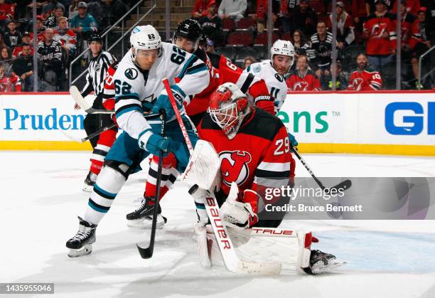 Kevin Labanc of the San Jose Sharks is stopped by Mackenzie Blackwood of the New Jersey Devils at the Prudential Center on October 22, 2022 in...