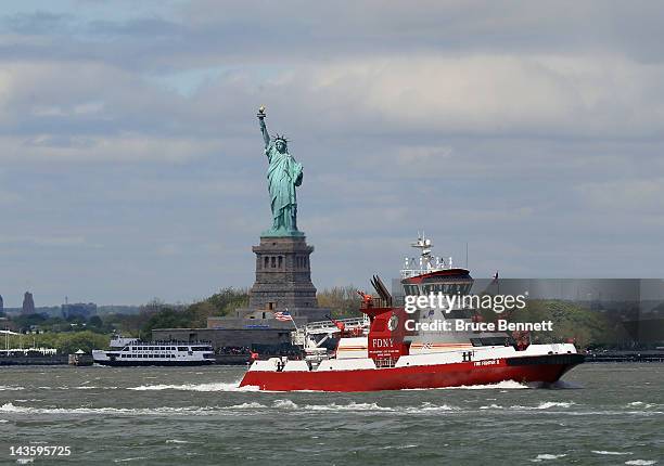 General view of the Statue of Liberty and the FDNY vessel Fire Fighter II as photographed on April 27, 2012 from the Red Hook section of Broooklyn,...