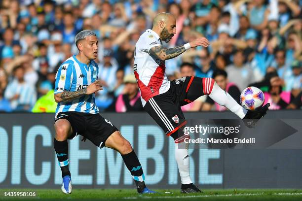 Javier Pinola of River Plate battles for possession with Enzo Copetti of Racing Club during a match between Racing Club and River Plate as part of...