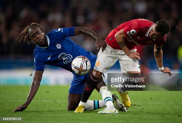 Trevoh Chalobah of Chelsea and Bruno Fernandes of Manchester United during the Premier League match between Chelsea FC and Manchester United at...
