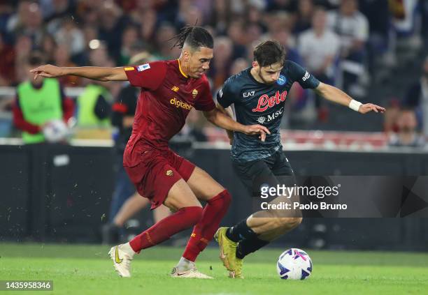Khvicha Kvaratskhelia of SSC Napoli battles for possession with Chris Smalling of AS Roma during the Serie A match between AS Roma and SSC Napoli at...