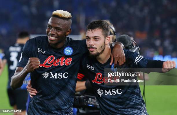 Victor Osimhen and Gianluca Gaetano of SSC Napoli celebrate following their side's victory in the Serie A match between AS Roma and SSC Napoli at...