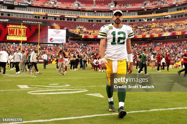 Aaron Rodgers of the Green Bay Packers walks off the field after the game against the Washington Commanders at FedExField on October 23, 2022 in...