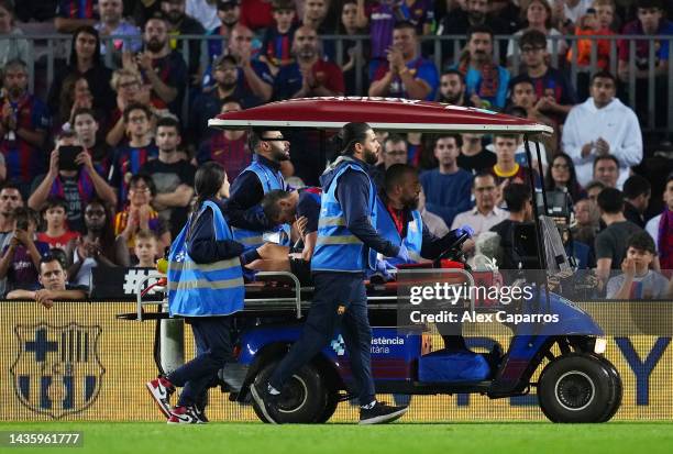 Sergi Roberto of FC Barcelona receives medical treatment while being taken off the pitch in a cart during the LaLiga Santander match between FC...