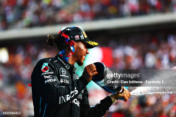 Second placed Lewis Hamilton of Great Britain and Mercedes celebrates on the podium following the F1 Grand Prix of USA at Circuit of The Americas on...