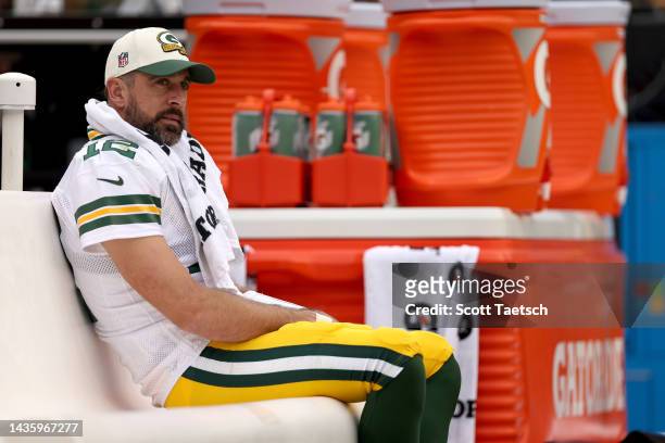 Aaron Rodgers of the Green Bay Packers looks on from the bench during the third quarter of the game against the Washington Commanders at FedExField...