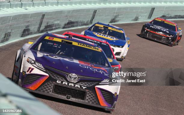 Denny Hamlin, driver of the FedEx Ground Toyota, leads the field during the NASCAR Cup Series Dixie Vodka 400 at Homestead-Miami Speedway on October...