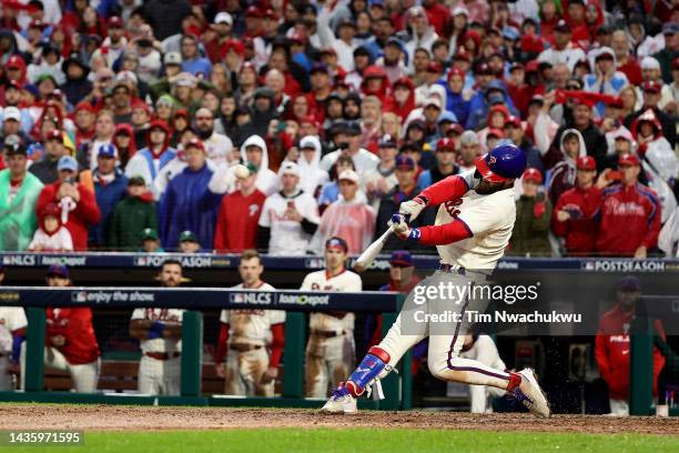 Bryce Harper of the Philadelphia Phillies hits a two run home run during the eighth inning against the San Diego Padres in game five of the National...