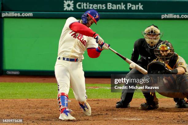 Bryce Harper of the Philadelphia Phillies hits a two run home run during the eighth inning against the San Diego Padres in game five of the National...