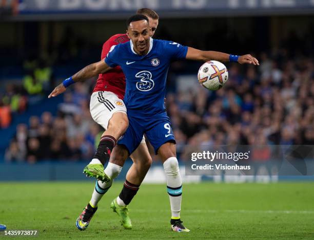 Luke Shaw of Manchester United is held off by Pierre-Emerick Aubameyang of Chelsea during the Premier League match between Chelsea FC and Manchester...