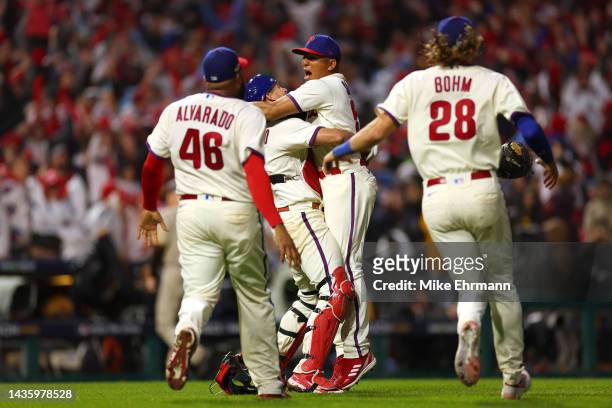 Ranger Suarez of the Philadelphia Phillies celebrates with J.T. Realmuto after defeating the San Diego Padres in game five to win the National League...