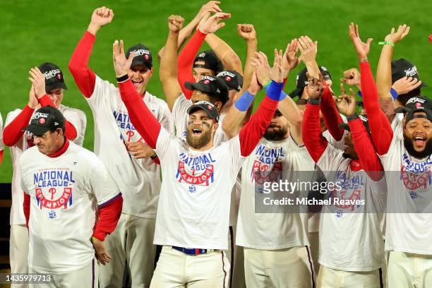 Bryce Harper of the Philadelphia Phillies celebrates with teammates after defeating the San Diego Padres in game five to win the National League...