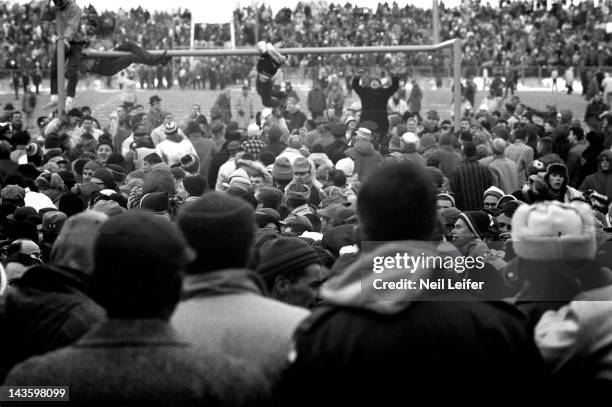 Championship: Overal view of Green Bay Packers fans victorious, hanging from goal posts after winning game vs New York Giants at City Stadium. Green...