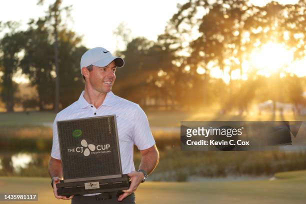 Rory McIlroy of Northern Ireland celebrates with the trophy after winning during the final round of the CJ Cup at Congaree Golf Club on October 23,...