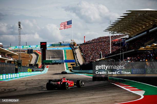 Charles Leclerc of Monaco driving the Ferrari F1-75 follows Max Verstappen of the Netherlands driving the Oracle Red Bull Racing RB18 on track during...