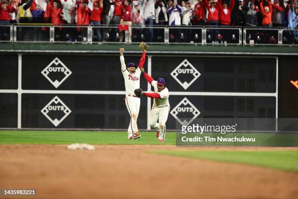 Nick Castellanos and Jean Segura of the Philadelphia Phillies celebrate after the Phillies defeated the San Diego Padres in game five to win the...