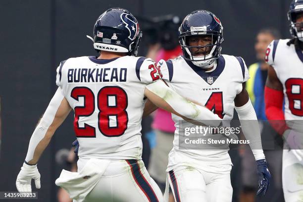 Phillip Dorsett is congratulated by teammate Rex Burkhead of the Houston Texans after a touchdown reception in the fourth quarter at Allegiant...