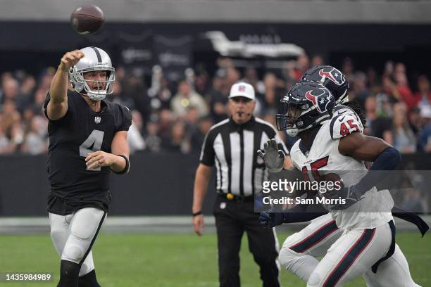 Derek Carr of the Las Vegas Raiders passes the ball in the fourth quarter against the Houston Texans at Allegiant Stadium on October 23, 2022 in Las...