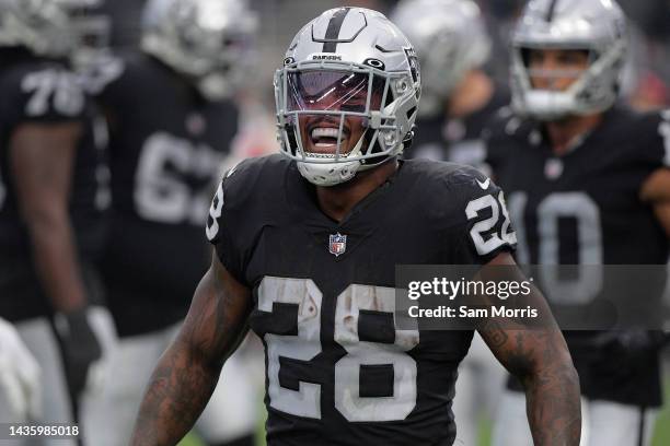 Josh Jacobs of the Las Vegas Raiders celebrates a touchdown in the fourth quarter against the Houston Texans at Allegiant Stadium on October 23, 2022...