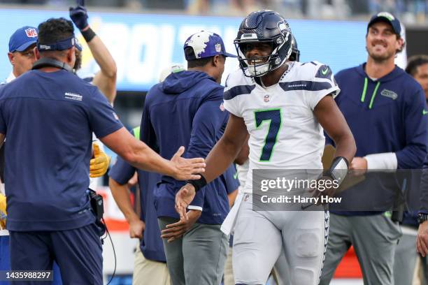 Geno Smith of the Seattle Seahawks celebrates after a touchdown during the fourth quarter of the game against the Los Angeles Chargers at SoFi...