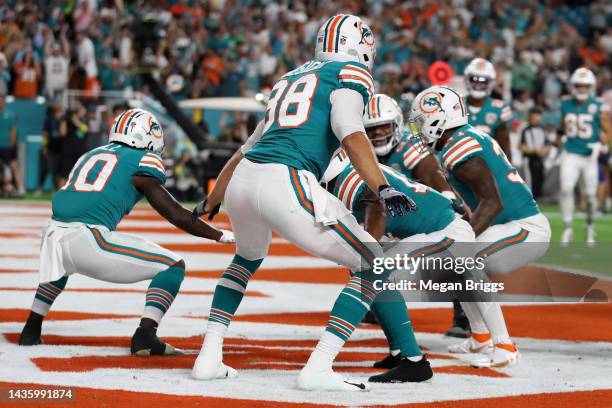 Raheem Mostert of the Miami Dolphins celebrates his touchdown with teammates during the first quarter against the Pittsburgh Steelers at Hard Rock...