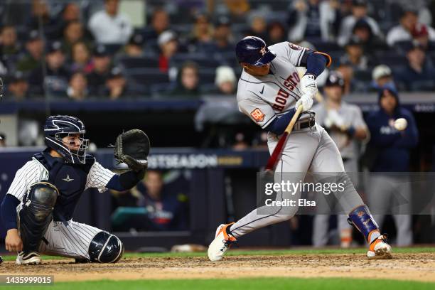 Jeremy Pena of the Houston Astros hits a three-run home run in the third inning against the New York Yankees in game four of the American League...