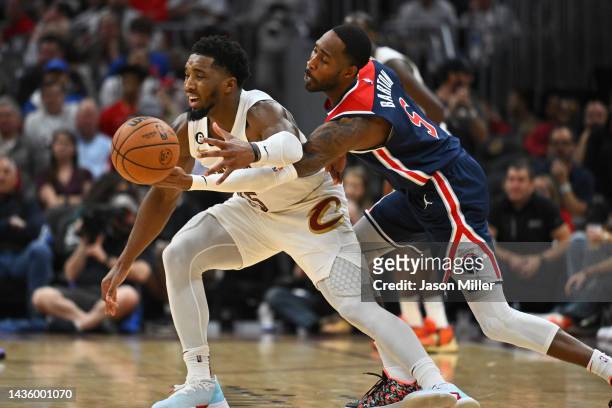 Will Barton of the Washington Wizards makes a steal from Donovan Mitchell of the Cleveland Cavaliers during the fourth quarter at Rocket Mortgage...