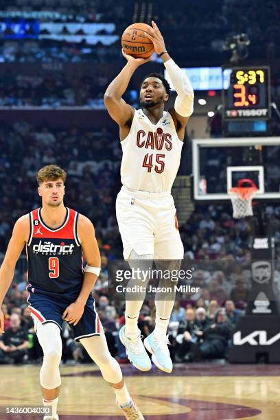 Donovan Mitchell of the Cleveland Cavaliers shoots ahead of Deni Avdija of the Washington Wizards during the second quarter at Rocket Mortgage...