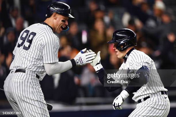 Harrison Bader of the New York Yankees celebrates his home run with Aaron Judge during the sixth inning against the Houston Astros in game four of...
