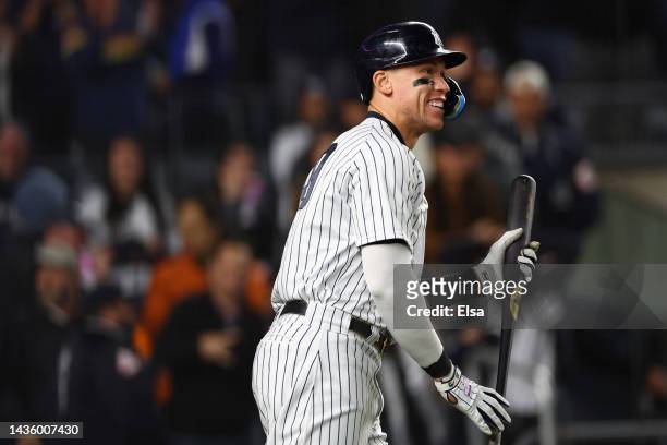 Aaron Judge of the New York Yankees smiles after a solo home run by Harrison Bader in the sixth inning against the Houston Astros in game four of the...