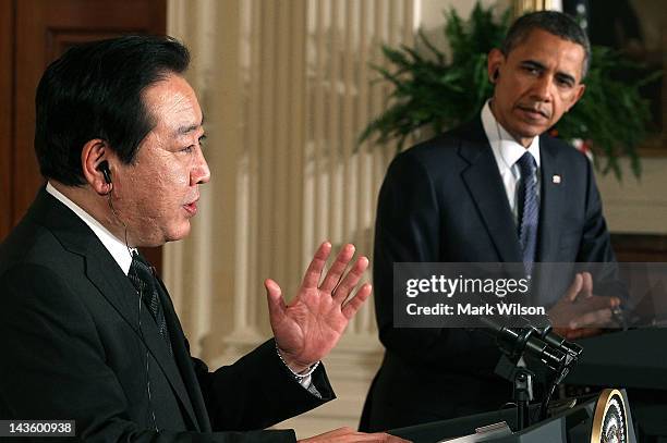 President Barack Obama listens as Japanese Prime Minister Yoshihiko Noda speaks during a news conference in the East Room at the White House on April...