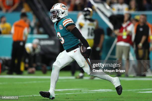 Noah Igbinoghene of the Miami Dolphins celebrates after intercepting a pass by Kenny Pickett of the Pittsburgh Steelers during the fourth quarter to...