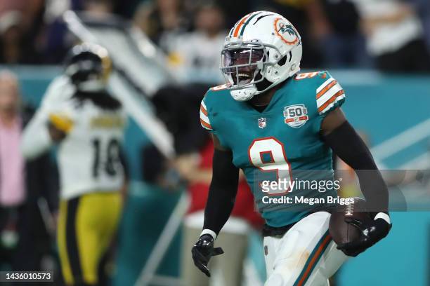 Noah Igbinoghene of the Miami Dolphins celebrates after intercepting a pass by Kenny Pickett of the Pittsburgh Steelers during the fourth quarter to...
