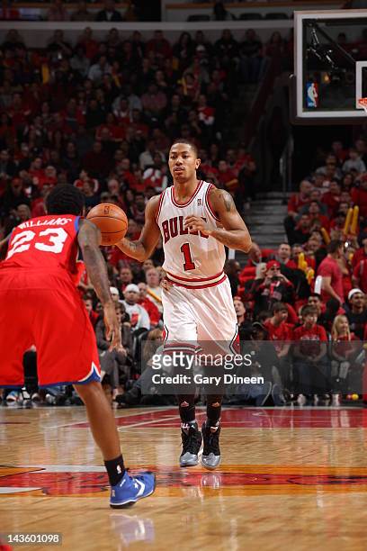 Derrick Rose of the Chicago Bulls dribbles against Louis Williams of the Philadelphia 76ers in Game One of the Eastern Conference Quarterfinals...