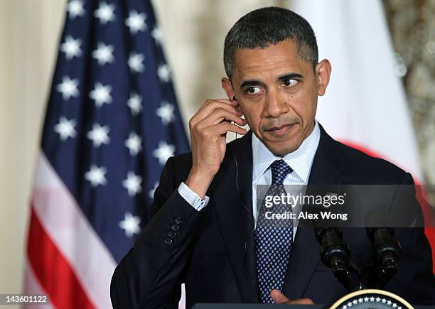 President Barack Obama listens during a news conference with Japanese Prime Minister Yoshihiko Noda at the East Room of the White House April 30,...