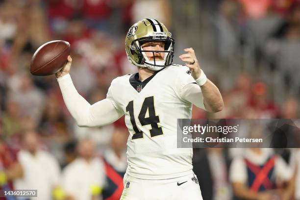 Quarterback Andy Dalton of the New Orleans Saints throws a pass during the NFL game against the Arizona Cardinals at State Farm Stadium on October...