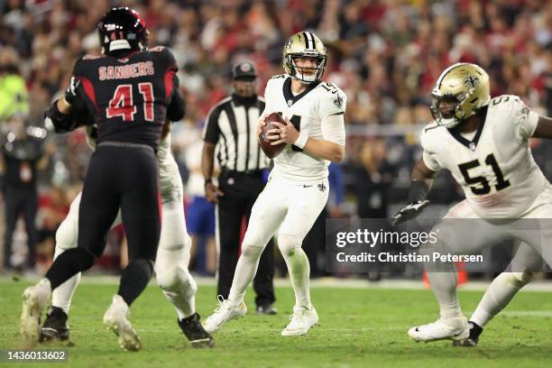 Quarterback Andy Dalton of the New Orleans Saints looks to pass during the NFL game at State Farm Stadium on October 20, 2022 in Glendale, Arizona....