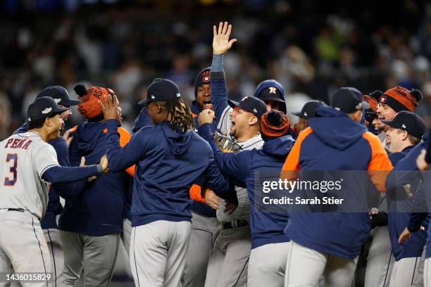 The Houston Astros celebrate after defeating the New York Yankees in game four to win the American League Championship Series at Yankee Stadium on...