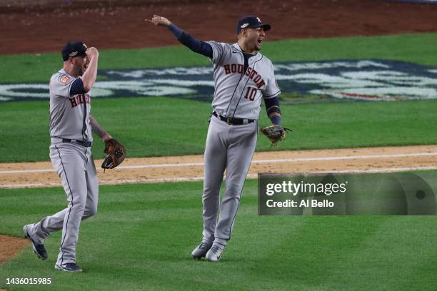 Ryan Pressly and Yuli Gurriel of the Houston Astros celebrate the out of Aaron Judge of the New York Yankees to win game four and the American League...