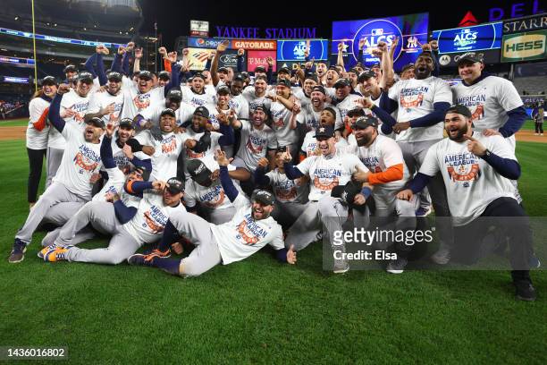 The Houston Astros pose for a team photo after defeating the New York Yankees in game four to win the American League Championship Series at Yankee...