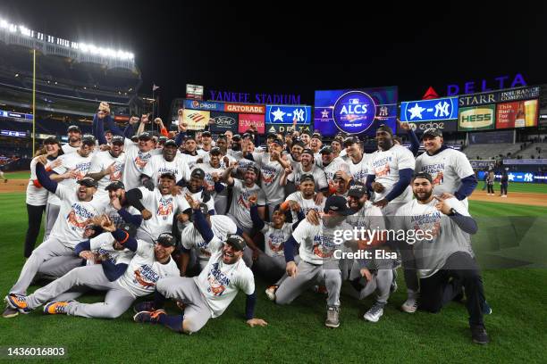 The Houston Astros pose for a team photo after defeating the New York Yankees in game four to win the American League Championship Series at Yankee...