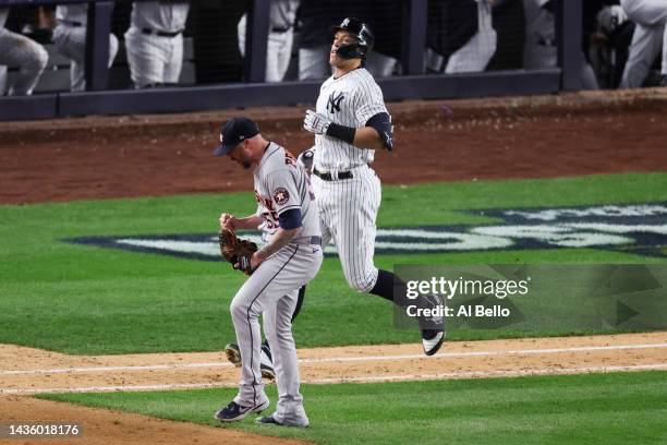 Ryan Pressly of the Houston Astros celebrates the final out of Aaron Judge of the New York Yankees to win game four of the American League...